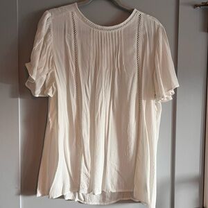 White blouse with hole design detail
